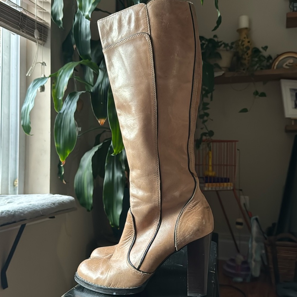 Tan 4 inch leather stacked boots by Aldo.